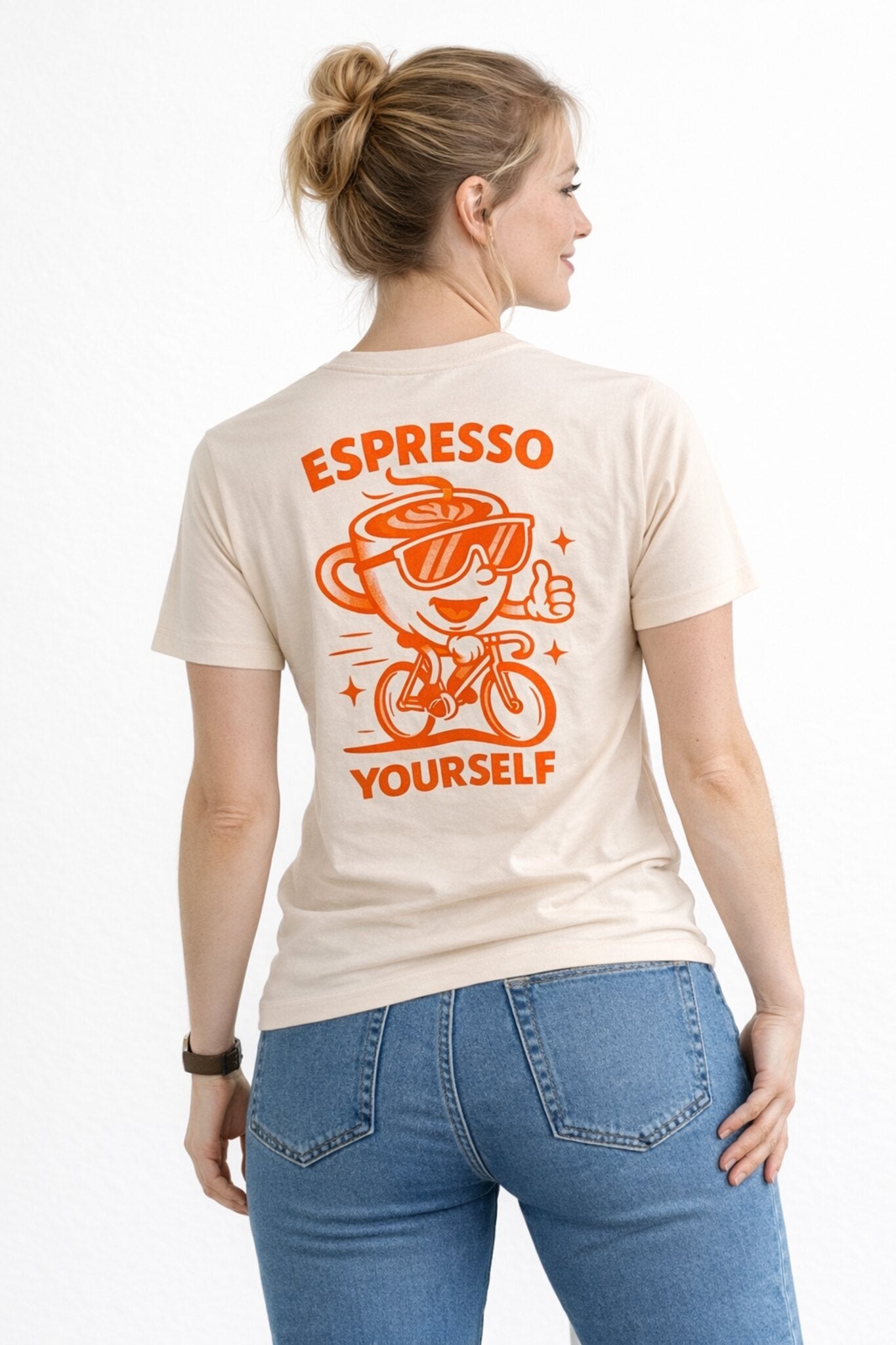 Woman wearing a t-shirt with 'Espresso Yourself' design on the back.
