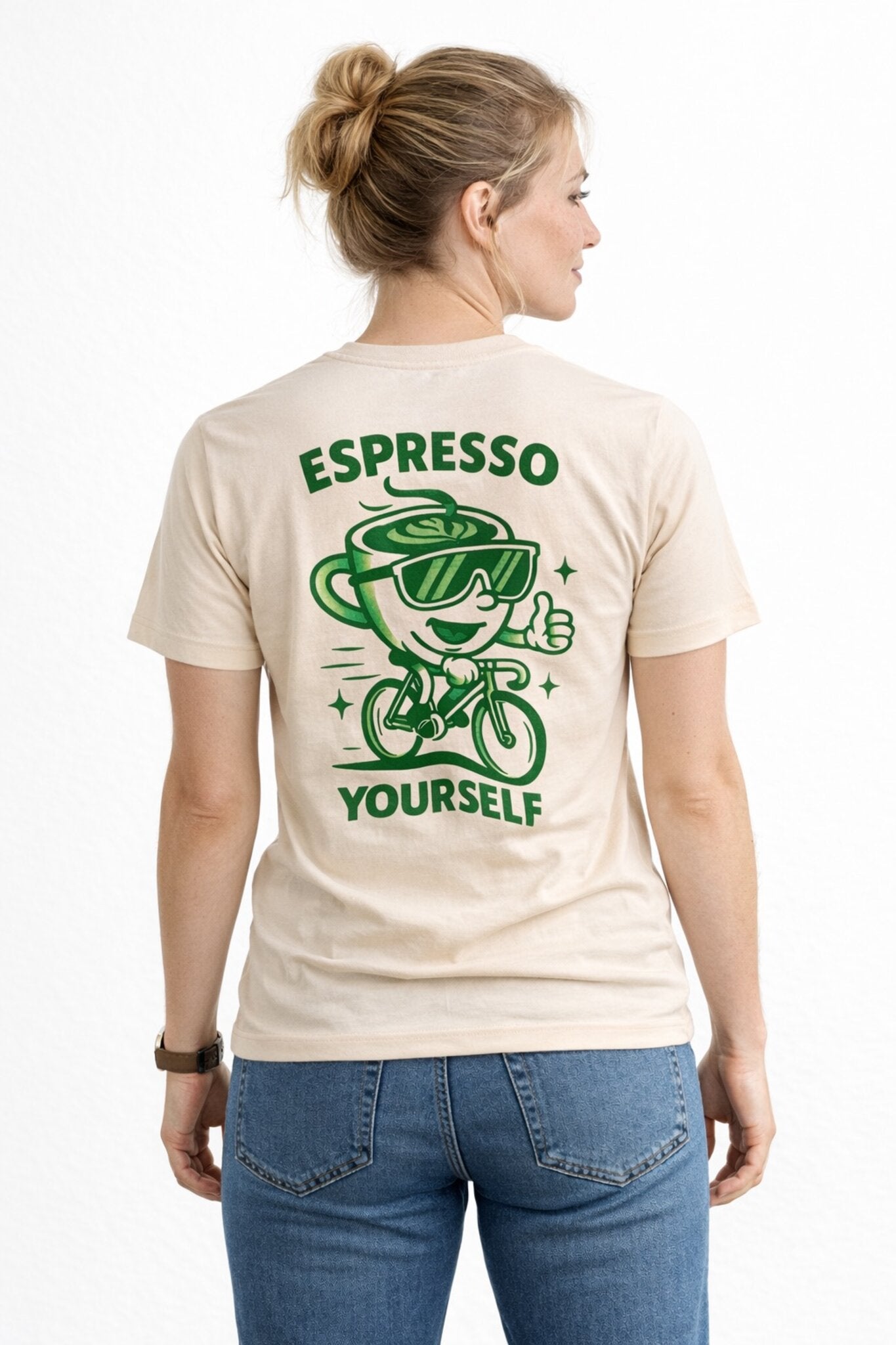 Woman wearing a raw t-shirt with a green graphic and text on the back, standing against a white background.